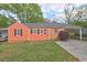 Charming home with a single carport, manicured lawn and cozy curb appeal at 5164 Phillips Dr, Forest Park, GA 30297
