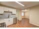 Bright kitchen featuring stainless steel appliances, granite countertops, and wood flooring at 5164 Phillips Dr, Forest Park, GA 30297