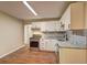 Contemporary kitchen boasting new cabinets, modern countertops and stainless appliances at 5164 Phillips Dr, Forest Park, GA 30297