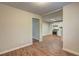 Open living room with wood floors leading to kitchen and other rooms at 5164 Phillips Dr, Forest Park, GA 30297