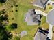 Overhead view of a property, highlighting the well-manicured lawn, landscaping, and proximity to the neighborhood at 6090 Pennant Ln, Suwanee, GA 30024