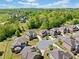 Aerial view of a neighborhood highlighting a home's location within a well-maintained community at 6090 Pennant Ln, Suwanee, GA 30024