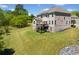 Grassy backyard with a deck perfect for grilling and a fenced area perfect for pets to run at 6090 Pennant Ln, Suwanee, GA 30024
