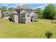 Sprawling backyard with lush greenery, deck, offering ample space for outdoor enjoyment and activities at 6090 Pennant Ln, Suwanee, GA 30024