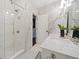 Elegant bathroom with glass shower and luxurious marble accents at 6090 Pennant Ln, Suwanee, GA 30024