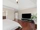 Large bedroom featuring hard wood floors and tray ceiling at 6090 Pennant Ln, Suwanee, GA 30024