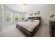 Comfortable bedroom with plush carpet, natural light, and neutral decor at 6090 Pennant Ln, Suwanee, GA 30024