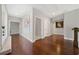 Hallway with hardwood floors and neutral walls featuring wall art and recessed lighting at 6090 Pennant Ln, Suwanee, GA 30024