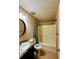 Bathroom featuring a vanity with a granite countertop and a shower/tub combo at 921 Hemingway Rd, Stone Mountain, GA 30088