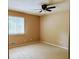 Small bedroom with carpeted floors and a ceiling fan at 921 Hemingway Rd, Stone Mountain, GA 30088