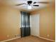 Bedroom featuring wall to wall carpet and a ceiling fan at 921 Hemingway Rd, Stone Mountain, GA 30088