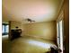 Open living room features a stone fireplace, french doors, plush carpeting and neutral walls at 921 Hemingway Rd, Stone Mountain, GA 30088