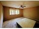 Bedroom with neutral walls, carpeted floors, and a ceiling fan at 921 Hemingway Rd, Stone Mountain, GA 30088