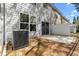 Back of house with AC Unit, privacy fence and cement patio at 1067 Brittania Rd, Stone Mountain, GA 30083