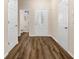 Welcoming entryway features hardwood floors and a view into the downstairs bathroom at 1067 Brittania Rd, Stone Mountain, GA 30083
