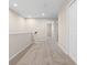 Second floor hallway with neutral carpet leading to bedrooms at 1067 Brittania Rd, Stone Mountain, GA 30083