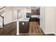 Open concept kitchen with large island, stainless steel appliances, and dark wood cabinets at 1067 Brittania Rd, Stone Mountain, GA 30083
