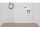 Empty laundry room space ready for appliances at 1067 Brittania Rd, Stone Mountain, GA 30083