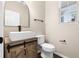 Stylish powder room with modern vanity, vessel sink, and wood-look cabinet at 1067 Brittania Rd, Stone Mountain, GA 30083