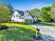 Well-manicured lawn and landscaping highlight this attractive home with a two-car garage at 2486 Ridgelake Dr, Villa Rica, GA 30180