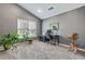 Office space with natural light, features a work desk, office chair, and decor accents at 2486 Ridgelake Dr, Villa Rica, GA 30180