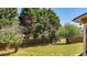 Fenced back yard featuring a lush lawn and mature trees providing shade and privacy at 28 Summer Nw Pl, Cartersville, GA 30121