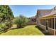 The home features a lush, green backyard with a well-maintained lawn and mature trees at 28 Summer Nw Pl, Cartersville, GA 30121