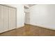 Bedroom with hardwood floors, closet, and white painted walls and trim for a bright and clean space at 28 Summer Nw Pl, Cartersville, GA 30121