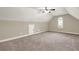 Spacious carpeted bonus room with a ceiling fan and a window for natural light at 28 Summer Nw Pl, Cartersville, GA 30121