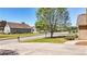 Landscaped front yard showcasing a lush lawn, mature trees, and inviting street view at 28 Summer Nw Pl, Cartersville, GA 30121