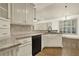 Bright kitchen with granite countertops, custom cabinets, and wood floors at 28 Summer Nw Pl, Cartersville, GA 30121