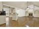 Open layout kitchen features white cabinetry, granite countertops, and modern appliances at 28 Summer Nw Pl, Cartersville, GA 30121