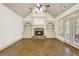 Spacious living room with stone fireplace, built-in shelving, and hardwood floors at 28 Summer Nw Pl, Cartersville, GA 30121