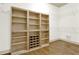 Walk-in closet featuring built-in shelving and hardwood floors at 28 Summer Nw Pl, Cartersville, GA 30121