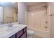 This bathroom features a single sink vanity, toilet, and a shower with plastic surround at 2808 White Oak Ln, Decatur, GA 30032