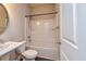 Cozy bathroom with a bathtub and shower combo with white tile surround, sink and toilet at 2808 White Oak Ln, Decatur, GA 30032