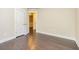 A lovely bedroom features light walls, gorgeous dark wood floors, and white doors at 2808 White Oak Ln, Decatur, GA 30032