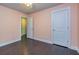 An empty bedroom features hardwood floors, neutral walls, and access to a closet at 2808 White Oak Ln, Decatur, GA 30032