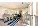 Open-concept dining and living area featuring modern lighting, fireplace and staircase at 2808 White Oak Ln, Decatur, GA 30032