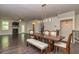 Dining and living room area featuring hardwood floors, fireplace, staircase and modern lighting at 2808 White Oak Ln, Decatur, GA 30032