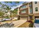 Well-kept townhome featuring a two-car garage and neat landscaping at 2808 White Oak Ln, Decatur, GA 30032