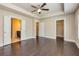 Spacious main bedroom with hardwood floors, en-suite bathroom, and walk-in closet entrances at 2808 White Oak Ln, Decatur, GA 30032