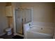 Bathroom featuring a separate tub and shower with tile surround, and a single sink at 5229 Pinnacle Pointe Ct, Norcross, GA 30071