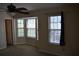 A bedroom features neutral walls, carpeted floors and a bay window at 5229 Pinnacle Pointe Ct, Norcross, GA 30071
