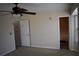 A bedroom features neutral walls, carpeted floors and en-suite bathroom access at 5229 Pinnacle Pointe Ct, Norcross, GA 30071