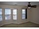 A bedroom features neutral walls, carpeted floors and lots of natural light at 5229 Pinnacle Pointe Ct, Norcross, GA 30071