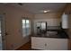 Compact kitchen with stainless steel refrigerator and breakfast bar at 5229 Pinnacle Pointe Ct, Norcross, GA 30071