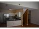 Compact kitchen with stainless steel appliances and a breakfast bar with dark countertops at 5229 Pinnacle Pointe Ct, Norcross, GA 30071