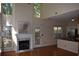Open living room features hardwood floors, fireplace and high ceilings with plenty of light at 5229 Pinnacle Pointe Ct, Norcross, GA 30071