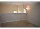 The open loft features neutral walls, carpeted floors and lots of natural light at 5229 Pinnacle Pointe Ct, Norcross, GA 30071